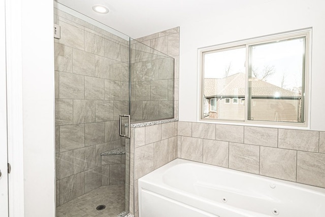 bathroom with separate shower and tub