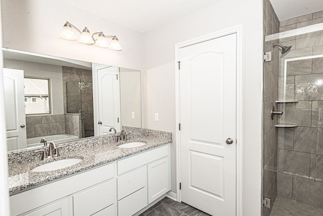 bathroom featuring vanity and shower with separate bathtub