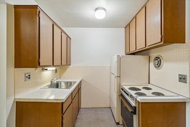 kitchen featuring electric range and sink