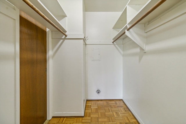 spacious closet with light parquet floors