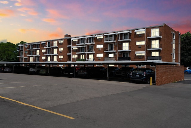 view of outdoor building at dusk