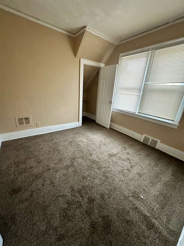 bonus room with vaulted ceiling, carpet flooring, visible vents, and baseboards