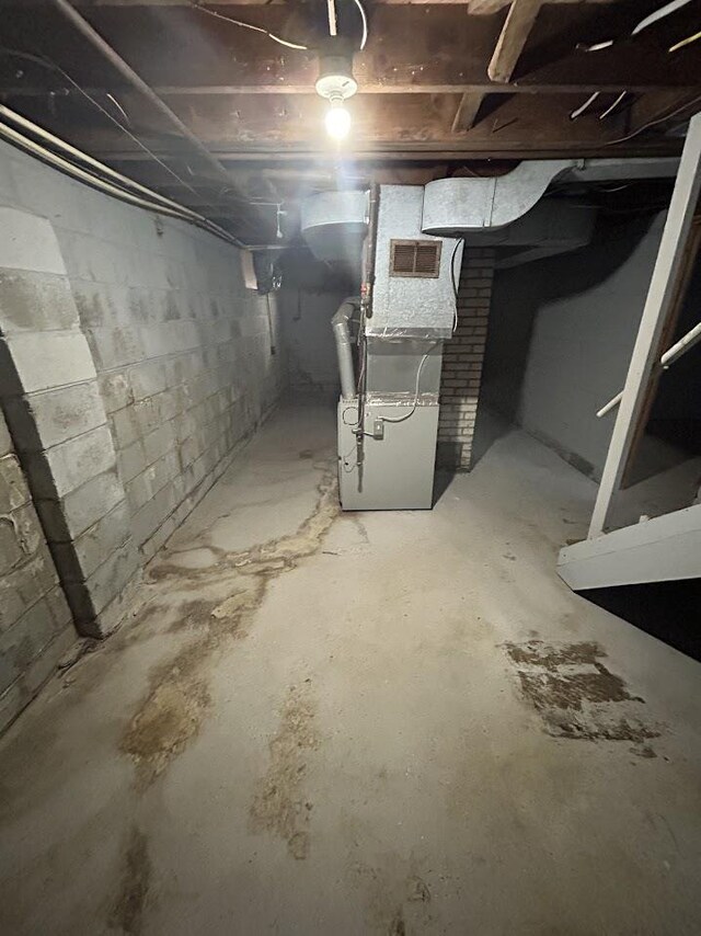 928 Mann Ave, Flint, MI 48503 - unfinished basement featuring heating unit
