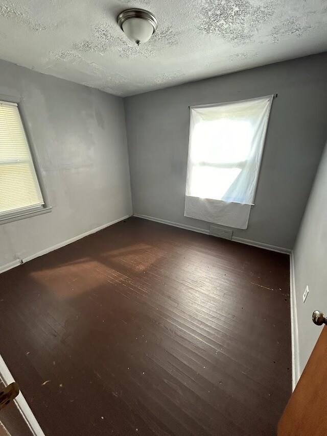928 Mann Ave, Flint, MI 48503 - empty room featuring wood finished floors and a textured ceiling