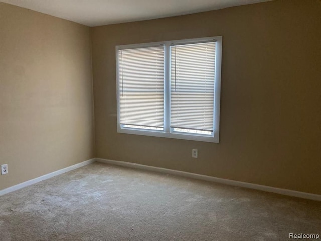 12293 Sorrento St, Detroit, MI 48227 - spare room featuring carpet and baseboards