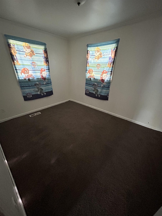 3288 Kissner Ave, Flint, MI 48504 - unfurnished room with dark carpet and baseboards