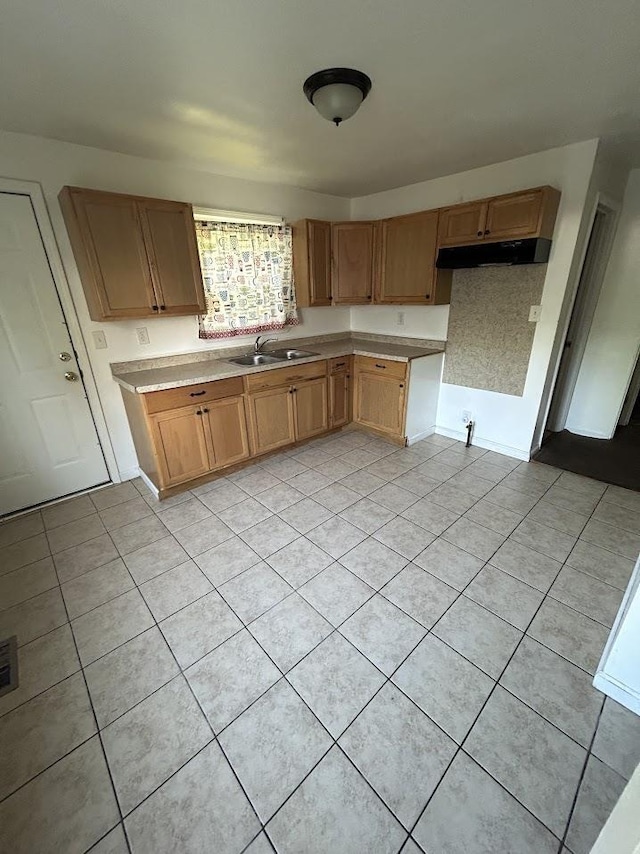 3288 Kissner Ave, Flint, MI 48504 - kitchen featuring under cabinet range hood, a sink, light tile patterned floors, and light countertops