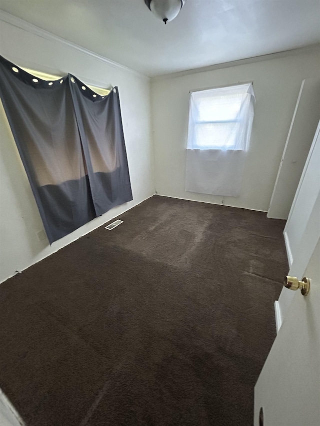 3288 Kissner Ave, Flint, MI 48504 - unfurnished room featuring dark carpet and ornamental molding