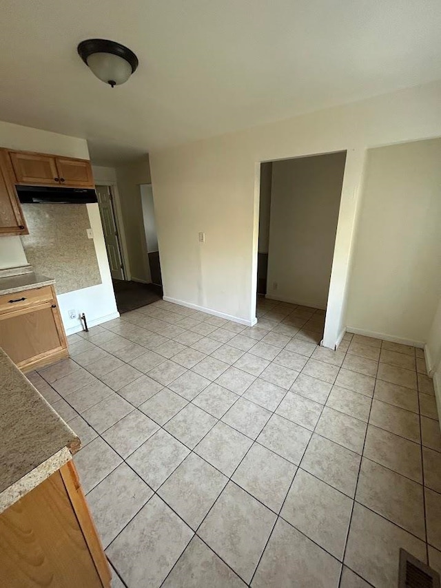 interior space with light tile patterned floors