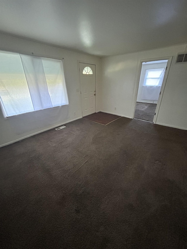 3288 Kissner Ave, Flint, MI 48504 - entrance foyer featuring dark carpet and baseboards