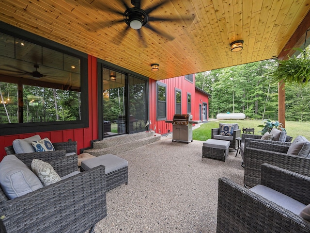 view of patio with an outdoor living space, grilling area, and ceiling fan