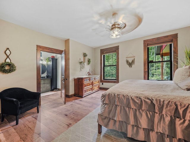 bedroom featuring light wood-type flooring and ceiling fan