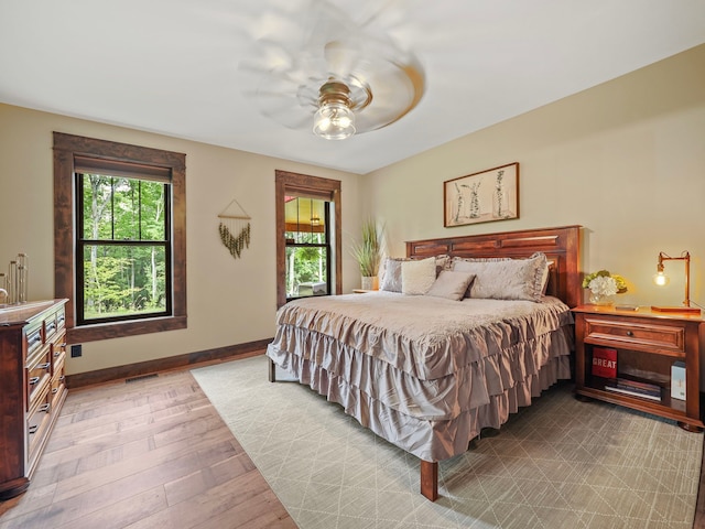 bedroom featuring light hardwood / wood-style flooring and ceiling fan