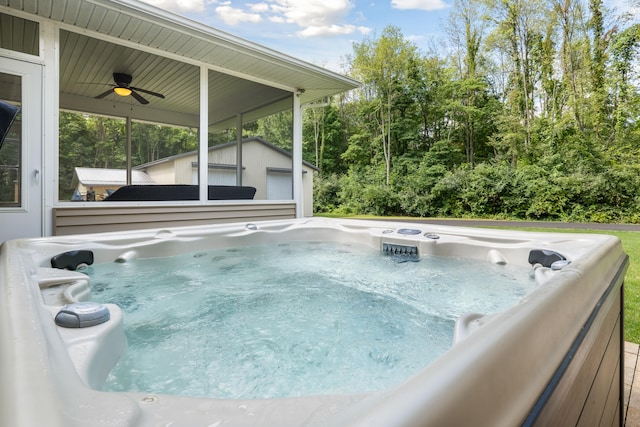 view of swimming pool featuring a hot tub and ceiling fan