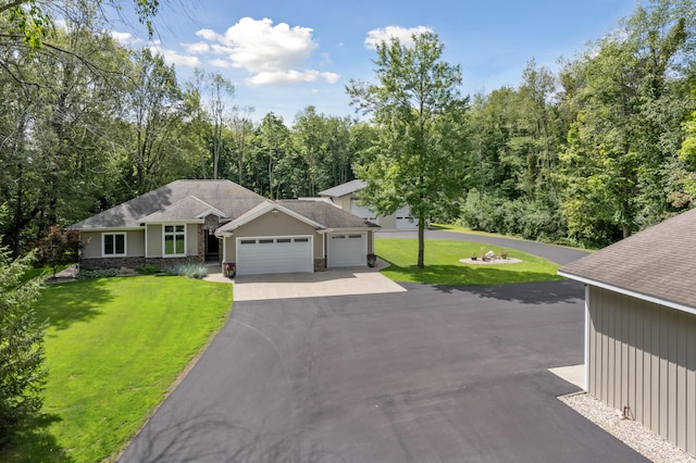 single story home with a front lawn and a garage