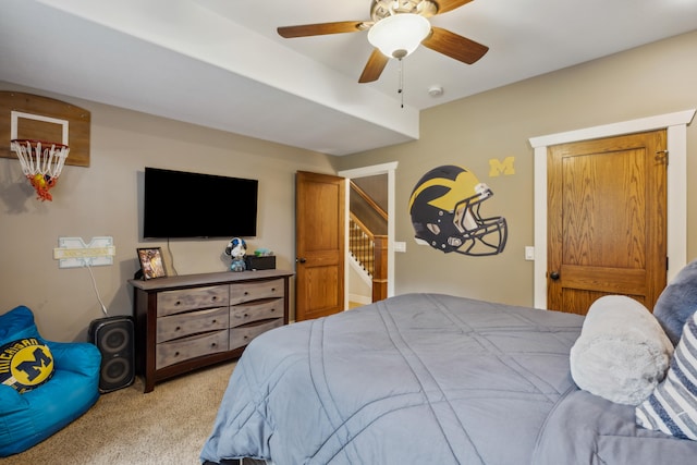 bedroom with ceiling fan and light colored carpet