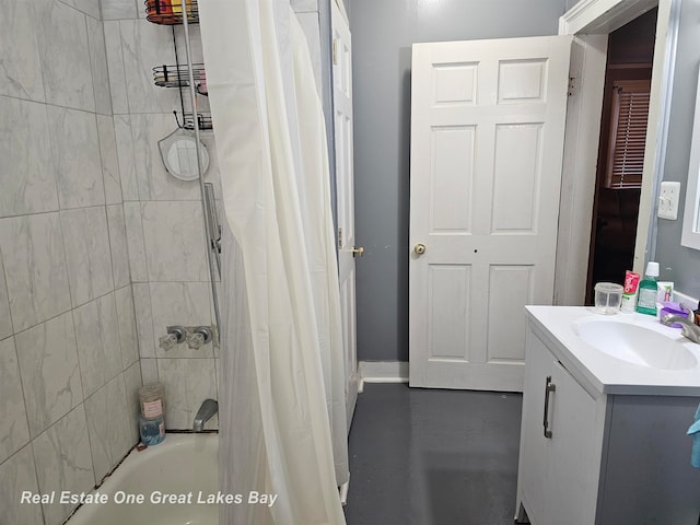 bathroom with shower / bathtub combination with curtain, vanity, and concrete flooring