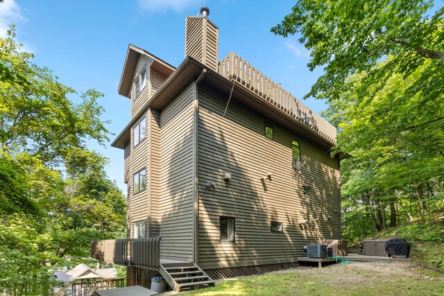 view of home's exterior with central AC