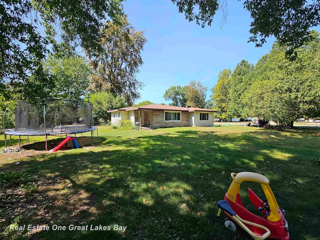 view of yard featuring a trampoline