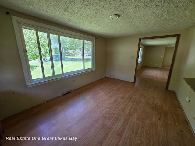 3810 Nicol Dr, Saginaw, MI 48601 - unfurnished room with wood finished floors and a textured ceiling