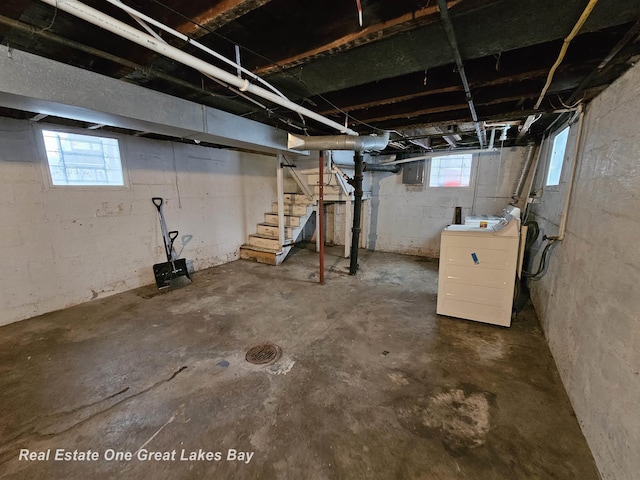 basement with washer / clothes dryer and a healthy amount of sunlight