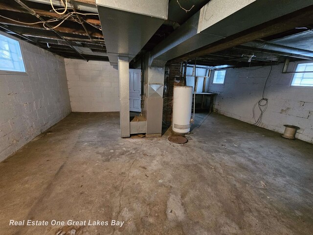 basement featuring water heater