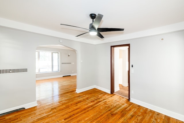 unfurnished room featuring ceiling fan and light hardwood / wood-style floors