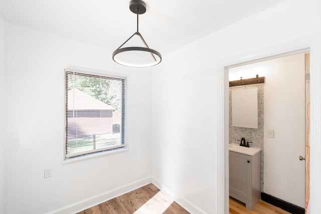 interior space featuring sink and light hardwood / wood-style flooring