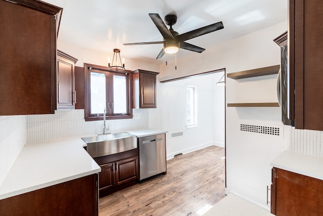 kitchen with sink, stainless steel dishwasher, ceiling fan, light wood-type flooring, and tasteful backsplash