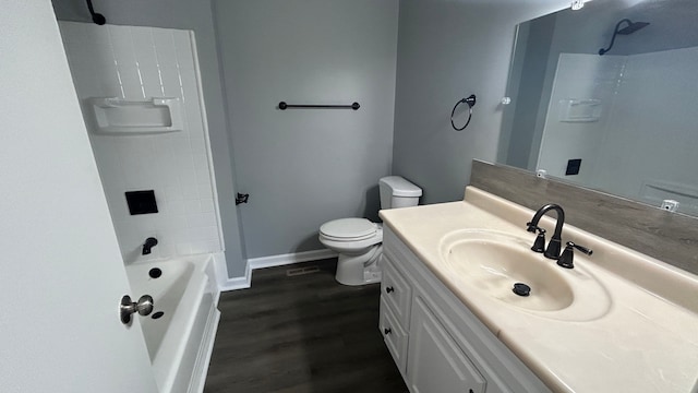 full bathroom featuring hardwood / wood-style flooring, vanity, toilet, and bathing tub / shower combination