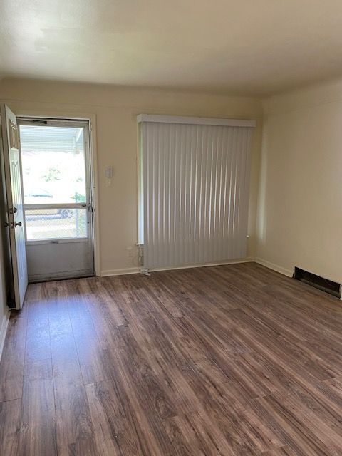 empty room featuring dark hardwood / wood-style floors