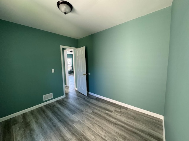 unfurnished room featuring hardwood / wood-style floors