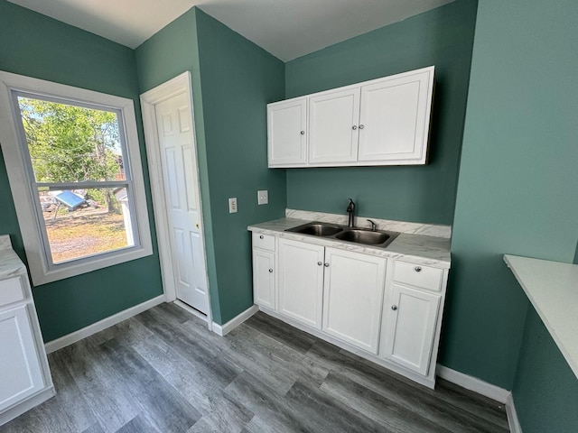 interior space with sink and dark wood-type flooring