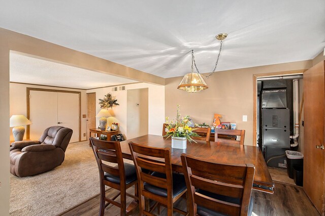 dining space with hardwood / wood-style flooring