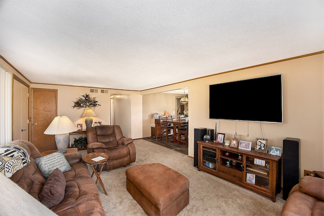 carpeted living room with a textured ceiling and ornamental molding