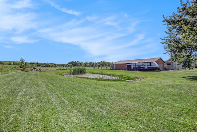 view of yard with a rural view