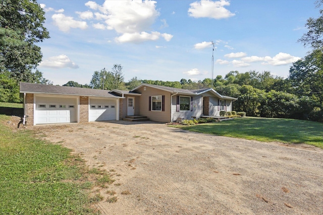 ranch-style house with a garage and a front yard