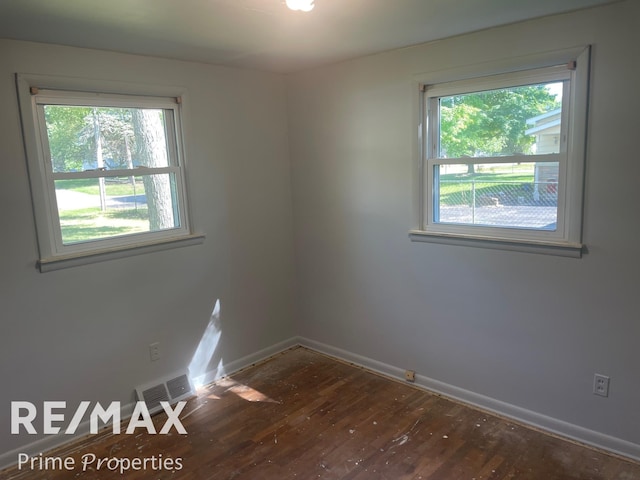 spare room featuring hardwood / wood-style floors