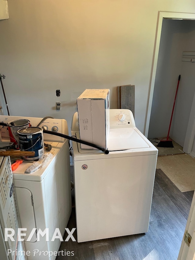 laundry area featuring washer and clothes dryer and dark hardwood / wood-style floors