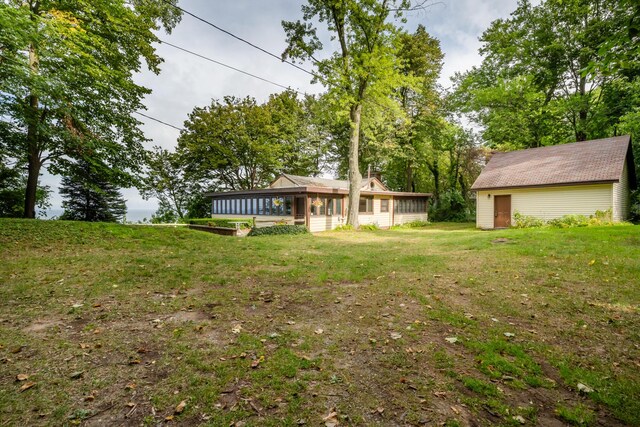 5212 Pier Rd, Coloma, MI 49038 - view of grassy yard featuring a sunroom