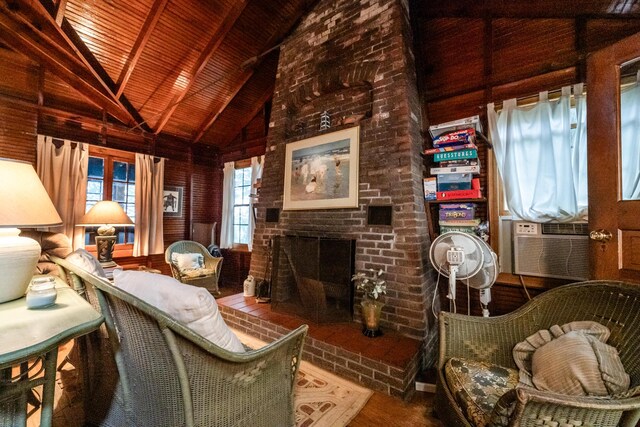 5212 Pier Rd, Coloma, MI 49038 - living area with high vaulted ceiling, a fireplace, cooling unit, wooden ceiling with exposed beams, and wood finished floors