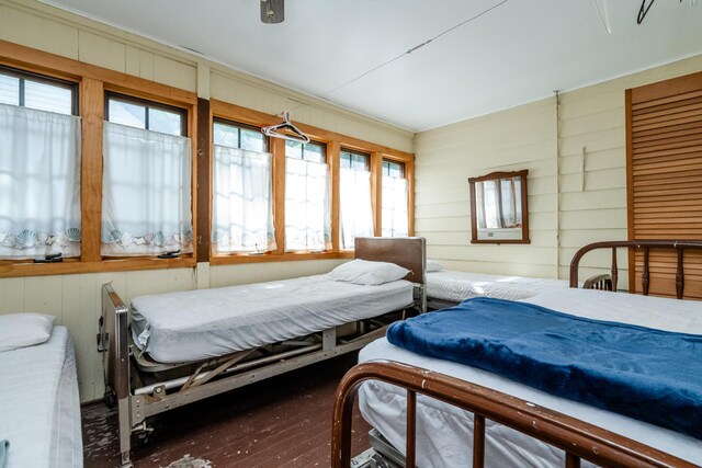 5212 Pier Rd, Coloma, MI 49038 - bedroom with multiple windows, wood finished floors, and wooden walls