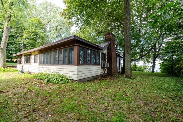 5212 Pier Rd, Coloma, MI 49038 - view of side of property featuring a chimney and a yard