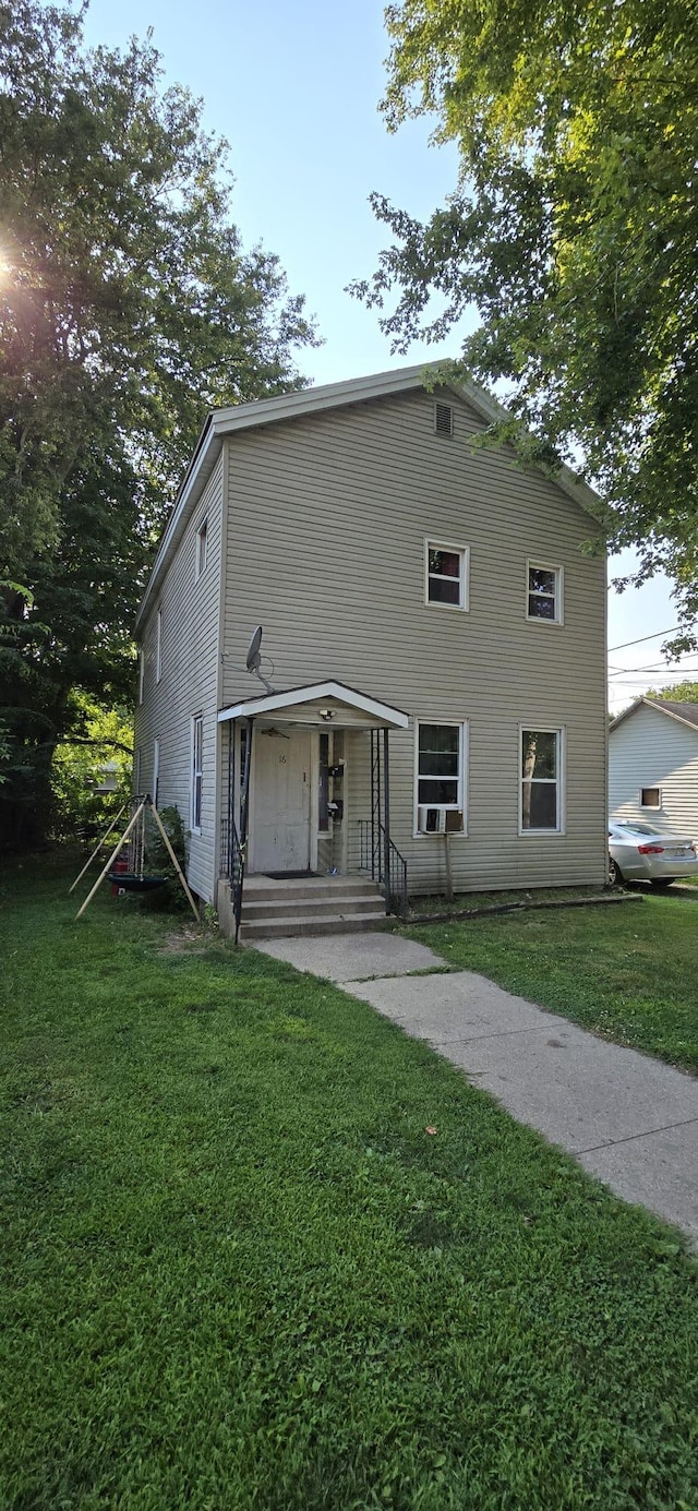 view of front of property with a front lawn