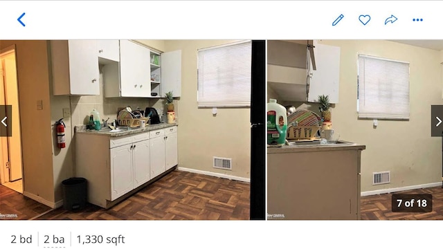 kitchen with white cabinets, dark parquet floors, backsplash, and sink