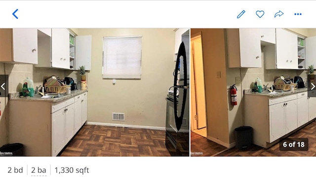 kitchen featuring white cabinets, decorative backsplash, dark parquet floors, and light stone countertops