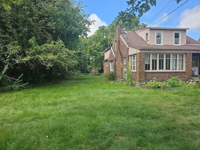 view of property exterior featuring a yard