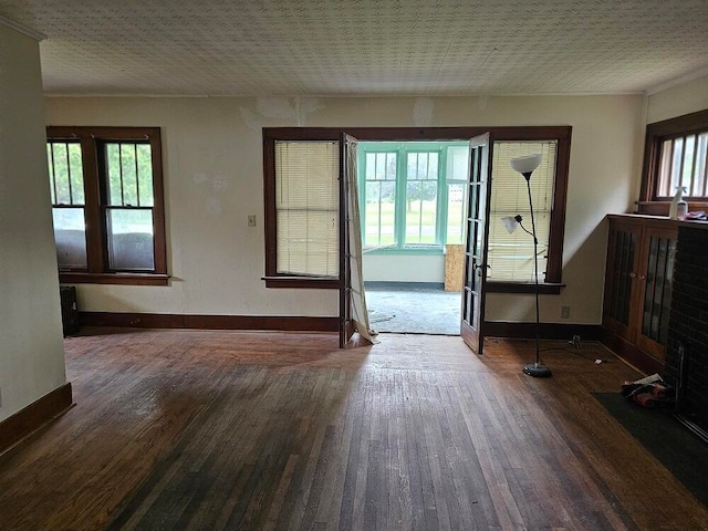 interior space with dark wood-type flooring and a wealth of natural light