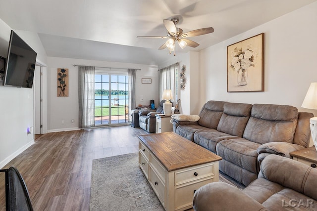 living room with hardwood / wood-style flooring and ceiling fan