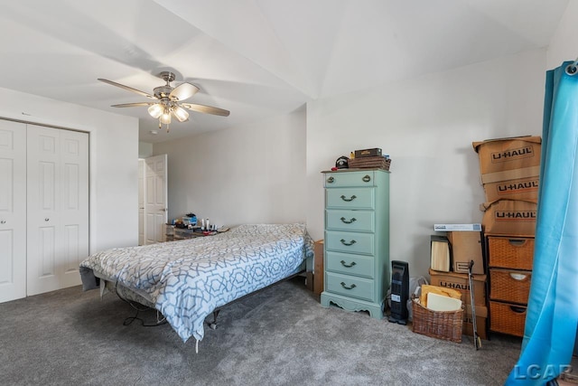 carpeted bedroom featuring a closet and ceiling fan